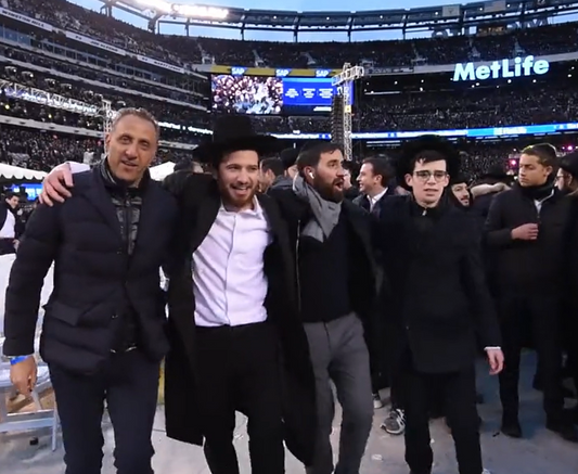People dancing at the siyum hashas